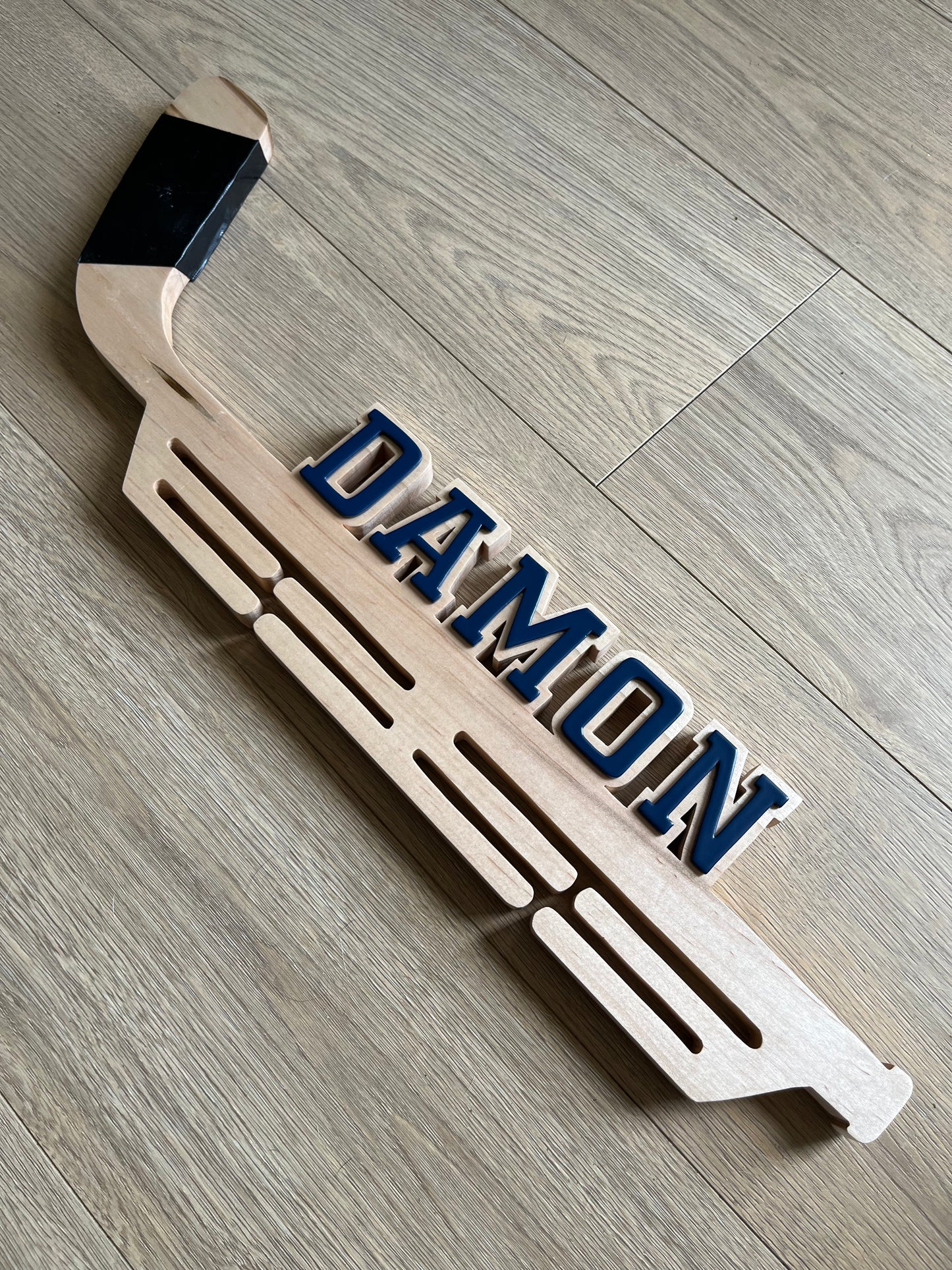 Hockey stick-medal hanger